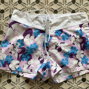 Purple floral print board shorts